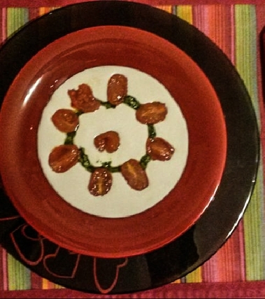 Crema di burrata con pesto e datterini confit