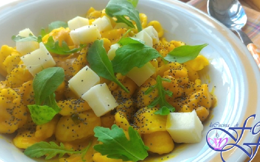 Orecchiette in crema di zucca con rucola e tuma